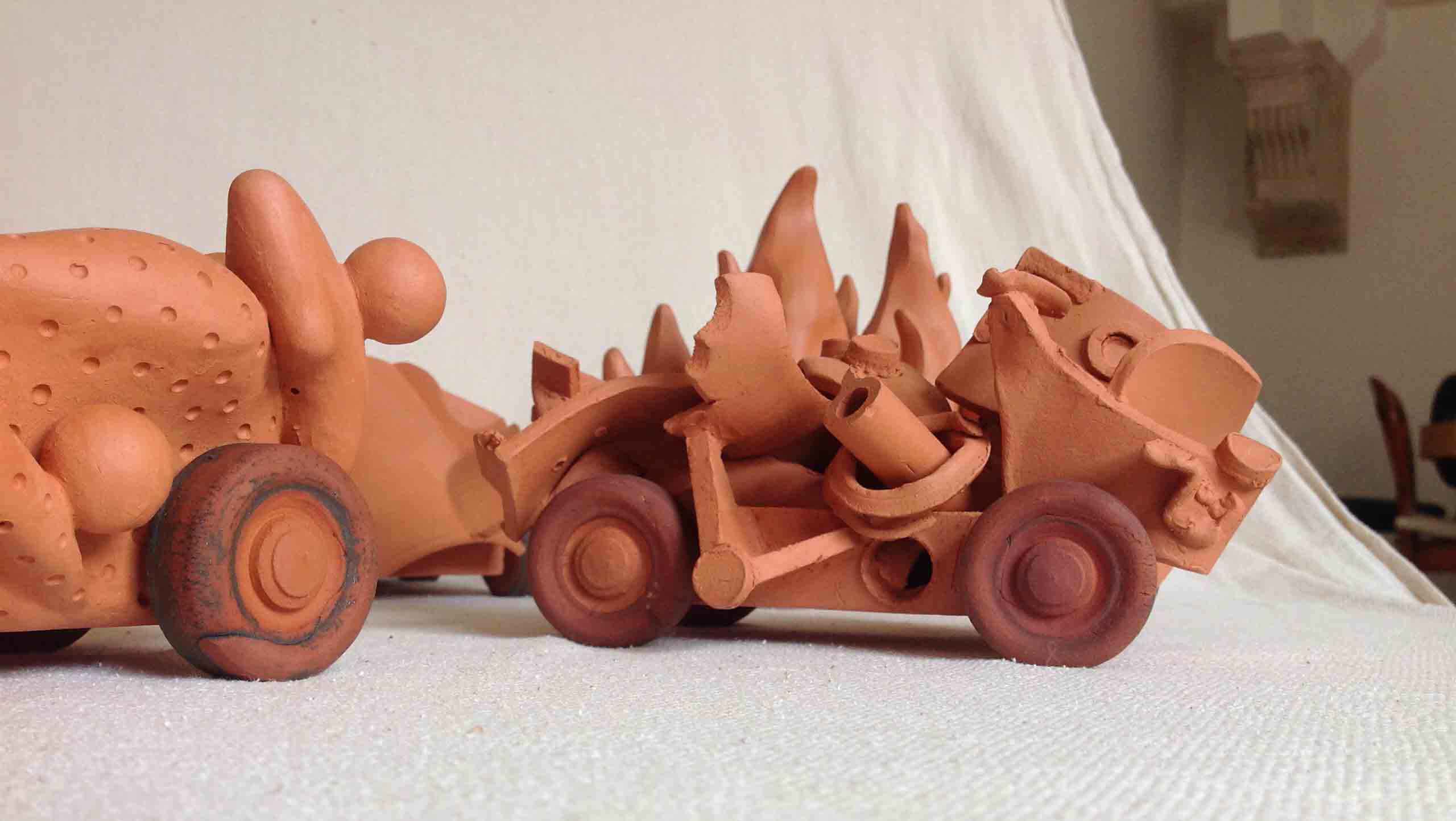 "Autobiography", a set of nine terra cotta vehicles each with their own characteristics such as this example: Junkyard