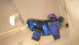 On the Threshold of destiny, a ceramic installation with earthenware compositions linked with three red threads