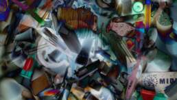 a jumble of small plastic, plaster, string, buttons and other small objects solarized in photoshop