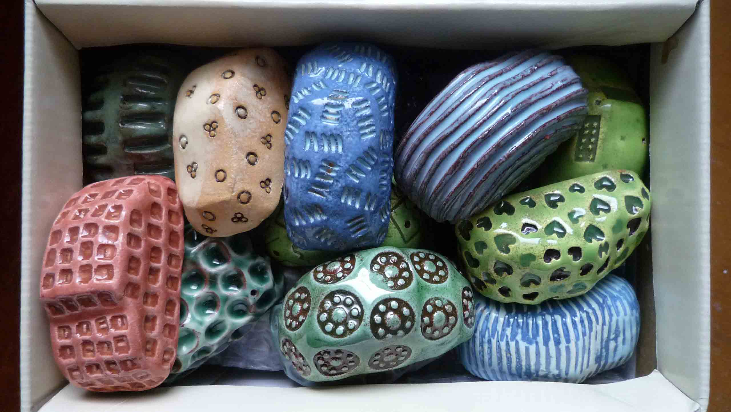 Karparc: A small box full of the components of "Karparc". A group of loosely modelled glazed car forms