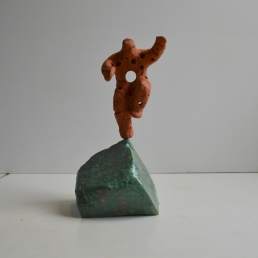 Quantum leap - perforated terracotta figure on a glazed base